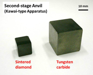 Second-stage anvils for a Kawai-type multianvil apparatus. A sintered diamond anvil with a 14-mm edge length and a tungsten carbide anvil with a 26-mm edge length